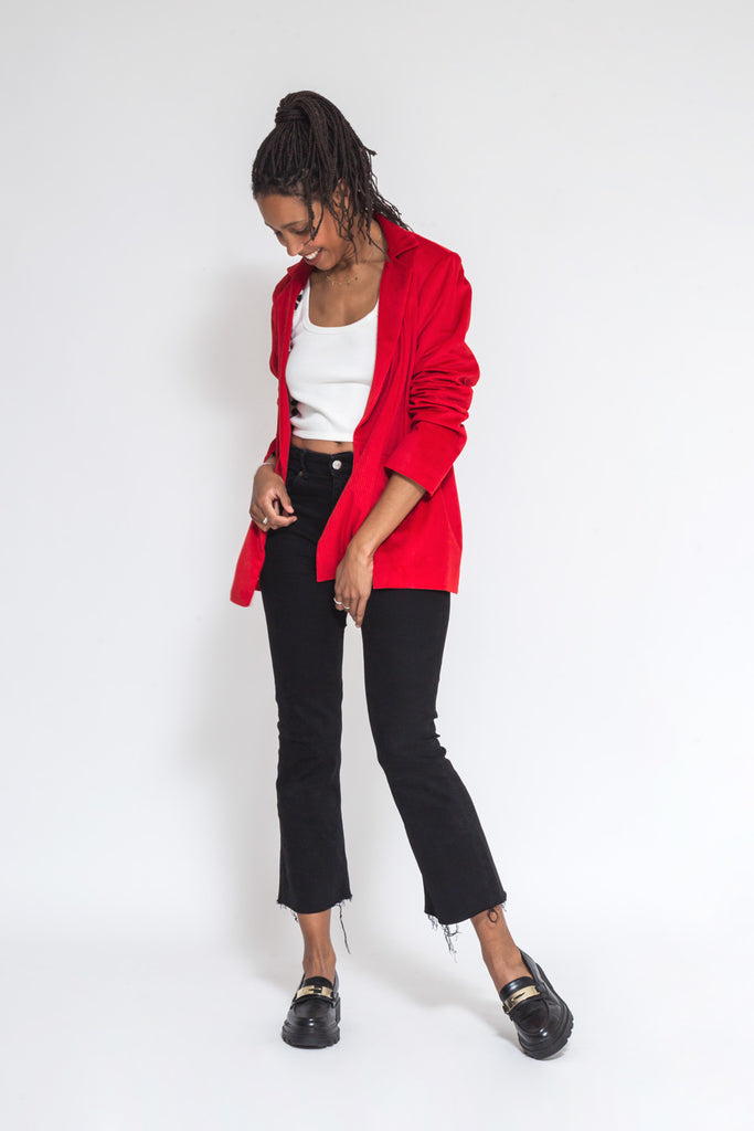 faded line red corduroy blazer made of dead stock fabric and viscose lining model is standing at her side